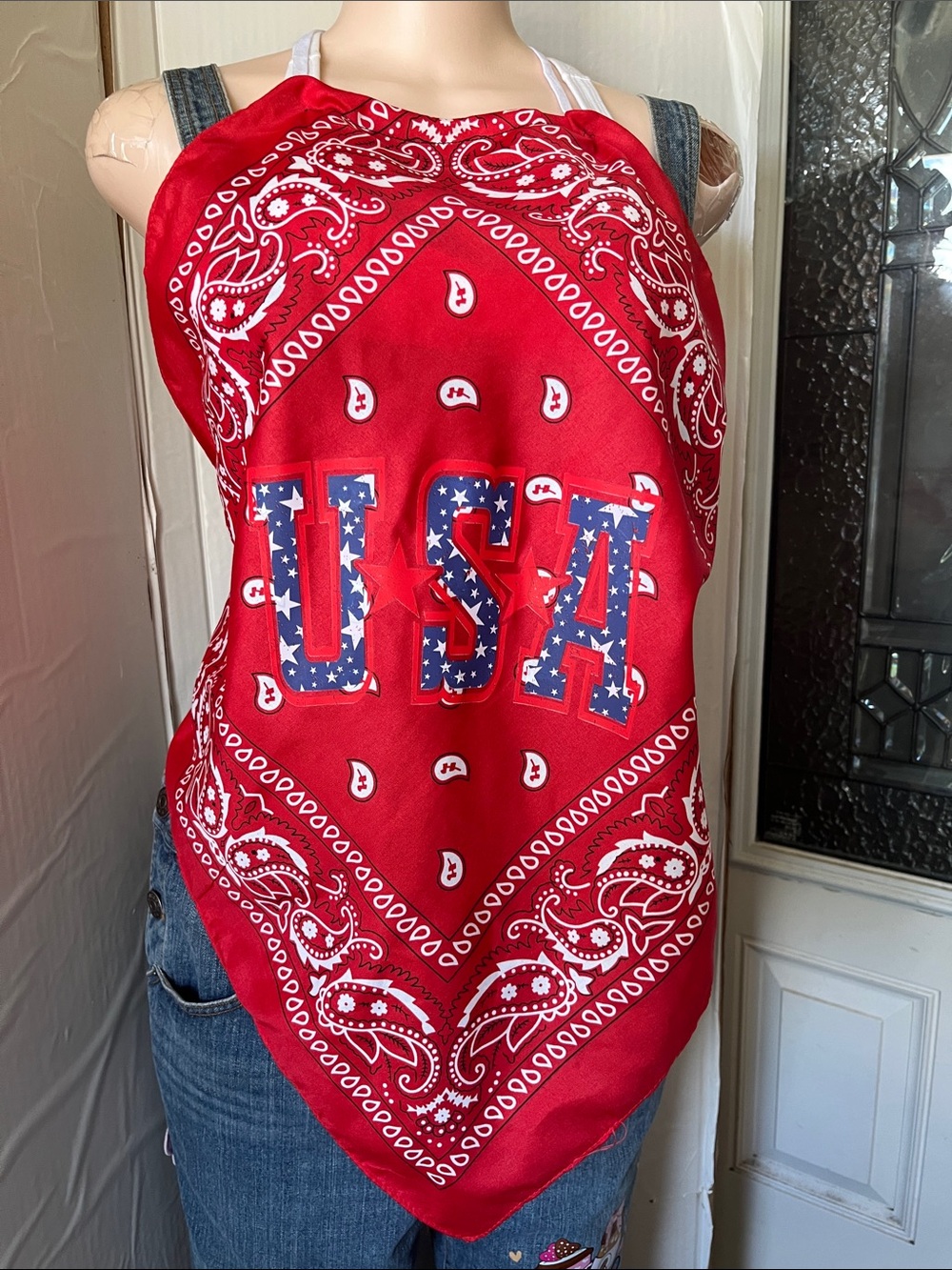 Red bandana top with Royal Blue USA emblem on the front. Paisley Halter top.